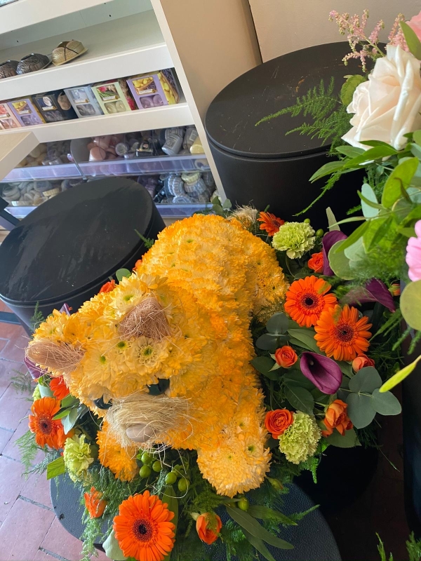 3D Cat Laying On a Bed of Flowers